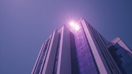 Naklejka premium Building's Facade Glitters in Sunlight, Sky Blue Backdrop, Tall Architecture
