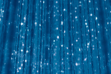 tokyo, japan - Garlands lights white glitter hanging vertical lines rain confetti