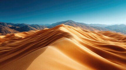 Fototapeta premium Vast desert dunes stretch towards a backdrop of majestic mountains under a vibrant blue sky.
