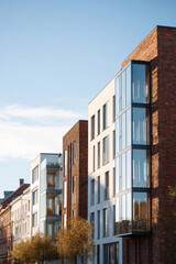 Obraz premium contemporary architectural facades without people featuring classic brick structures intertwined with modern