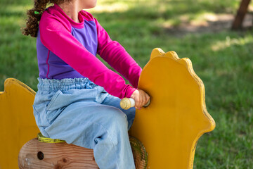 Child playing outside, good activity and sport for health and mental health