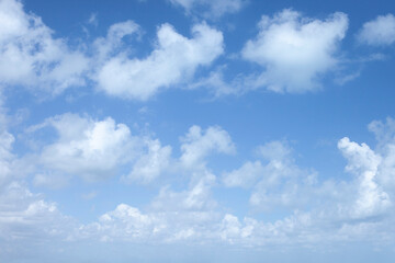 Fototapeta premium Fresh Blue Sky with Floating White Clouds