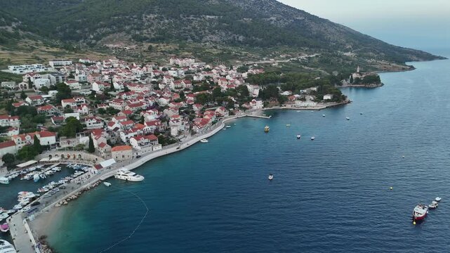 Aerial drone birds eye view of bol Brač croatian island tourist coastal town city croatia adriatic sea zlatni rat golden horn beach