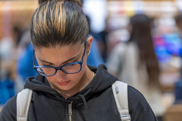 Teenage girls exploring and choosing the latest innovative tech gadgets at a modern store