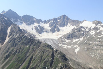 Caucasus Mountains on a sunny summer day view from Mount Elbrus