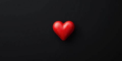 Obraz premium Single red heart against stark black backdrop, red heart, romance