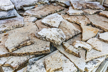 Stack of Weathered Stone Pavers with Natural Texture