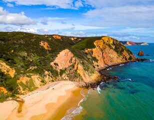 Coastal cliffs meet a sandy beach