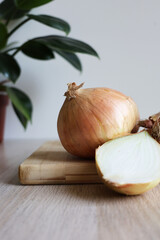 Fresh Onions on Wooden Cutting Board