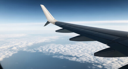 Obraz premium Airplane Wing and Tail Section Above Fluffy Clouds.