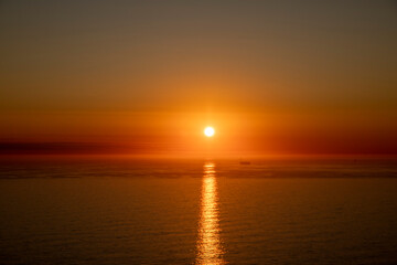 Golden Sunset Over Calm Ocean Horizon