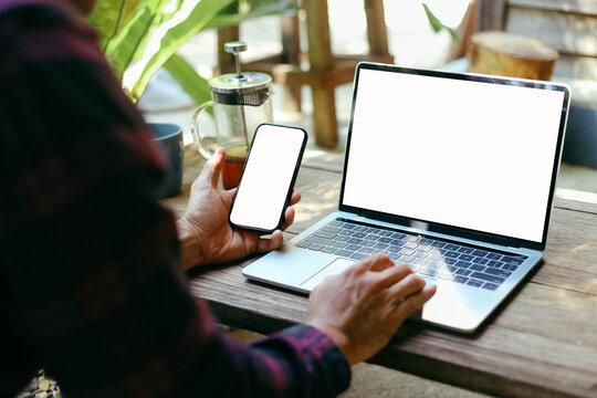 computer screen,mobile phone blank mockup.work using laptop texting mobile.white background for advertising,contact business search information on desk in cafe.marketing,design