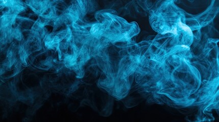 Obraz premium A vivid puff of cyan smoke swirls gracefully against a black background. The fluffy texture and wispy edges are emphasized, with the smoke tapering off