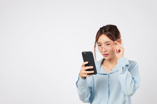 Vision issue with screen, woman holding glasses shows vision loss and problem reading text message due to bad eyesight and looking strain. isolated studio white background