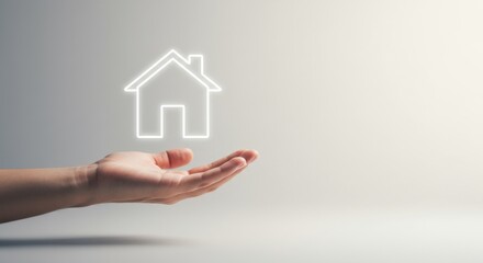 Naklejka premium A single hand holding up a glowing outline of a house icon, representing real estate and home security