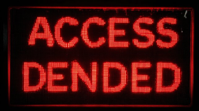 Access Denied: A digital display emphatically proclaims 'ACCESS DENIED' in a bold, red, pixelated font, conveying a clear message of restriction and prohibition. - Powered by Adobe