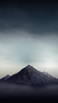 Mountain landscape with cloudy sky and fog looping animation background