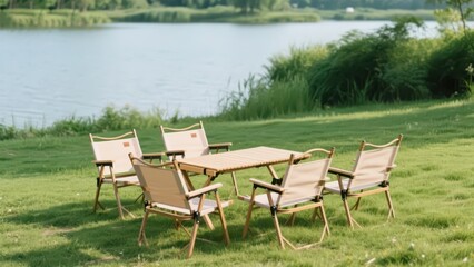 On the lawn by the lake, outdoor tables and chairs are neatly arranged, backed by mountains, waters and green plants, creating a cozy camping and leisure atmosphere.