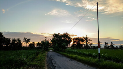 What a beautiful view. The streets weren't crowded in the morning. The sun rose in a beautiful orange hue. The blue sky combined with the orange hues created an extraordinary beauty.