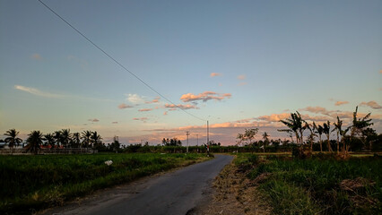 What a beautiful view. The streets weren't crowded in the morning. The sun rose in a beautiful orange hue. The blue sky combined with the orange hues created an extraordinary beauty.