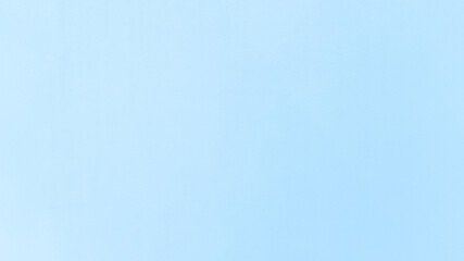 Baby blue flows like a silent sea against the cement wall calm, clear, and endlessly soothing.