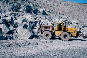 K-700 Kirovets tractor with attached scraper and hydraulic hamme