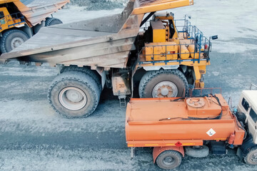 tanker for a mining dump truck refuels it. © Olga