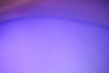 Empty space abstract purple blurred background with soft lines of orange and red blending together creating a smooth flowing and dreamy visual effect for modern and artistic design use