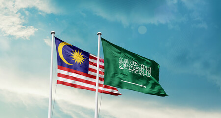 Malaysia and Saudi Arabia friendship flags are waving in the sky. Two country flag for agreement or deal. Malaysia KSA national flag for commitment.
