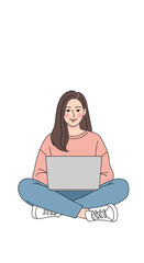 Young woman sitting cross legged working on a laptop computer with a happy expression