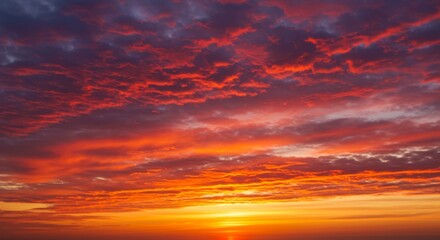 Fototapeta premium Fiery Sunset Sky with Vivid Red and Orange Clouds