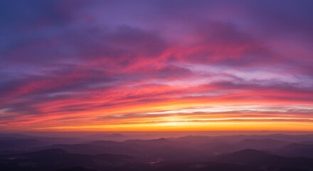 Obraz premium Vibrant Sunset Over Cityscape with Colorful Clouds