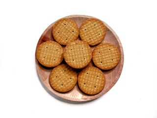 Round crunchy biscuits arranged on a plate, perfect for snack, breakfast, or tea time. Tasty cookies with golden brown texture, ideal for food, bakery, and dessert concepts.