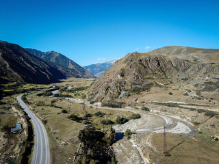 Scenic aerial view of highway and Caucasus mountains near Bylym village, Kabardino-Balkaria, Russia