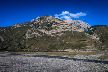 Fototapeta premium Landscape with mountains and Terek river in Ingushetia, Russia