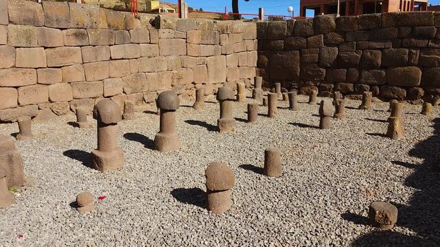 A panning shot reveals the intriguing interior of the Uyo Inca Temple in Chucuito, Peru. This ancient archaeological site features numerous unique stone phallic sculptures
