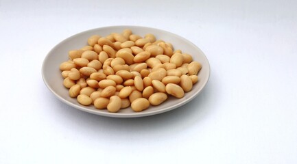 A plate of baked beans isolated on white background
