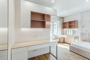 Modern minimalist bedroom with natural light showcasing wooden flooring and neutral color palette