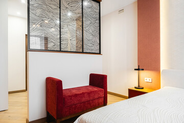 Modern bedroom design featuring minimalist decor and stylish furnishings in a cozy accommodation space