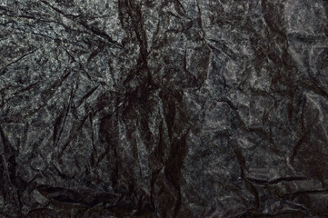 crumpled paper isolated on black background