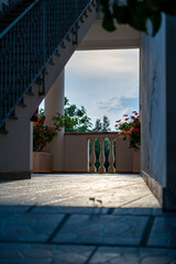 Sunlit Veranda with Flowers and Classic Railings, Mediterranean Villa – Southern Italy