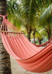 Relaxing Pink Hammock Between Palm Trees on a Tropical Beach