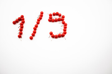 Red push pins form the shape of 