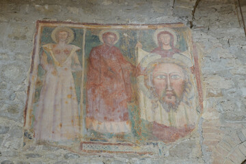 14th-century votive fresco with saints and Veronica's veil, interior of San Michele Arcangelo, Perugia, Italy.