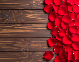 Wooden background with scattered red rose petals, romantic and elegant design for love-themed projects. Generative AI