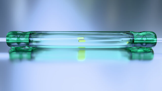 Reed Switch - Reed Relay - Electronic components. Closeup of a magnetically operated, green glass reed switch type SPST with Gold flashed contacts in the open position.