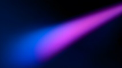 Diagonal beam of blue and pink light illuminating a dark background