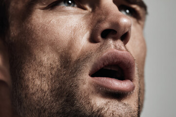 Fototapeta premium closeup portrait of man with open mouth taking deep breath expressing pure emotion