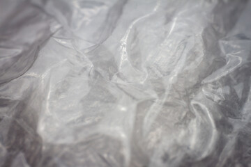 Fototapeta premium Extreme macro of plastic bubble wrap texture. Selective soft focus, shallow depth of field. Abstract dreamy background