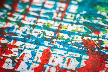 Naklejka premium Extreme close up of colorful acrylic paint texture showing brush strokes. Selective focus.